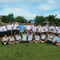 James, Richie and Josh with students at one of the schools they volunteered in June 2012