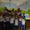 Lauren in newly painted classrooms with students