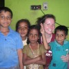 Lucy Allcock with host family children in 2012