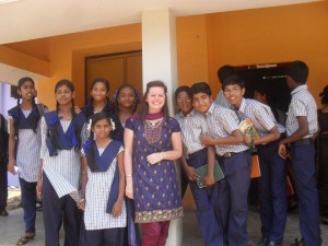 Lucy with students at her school